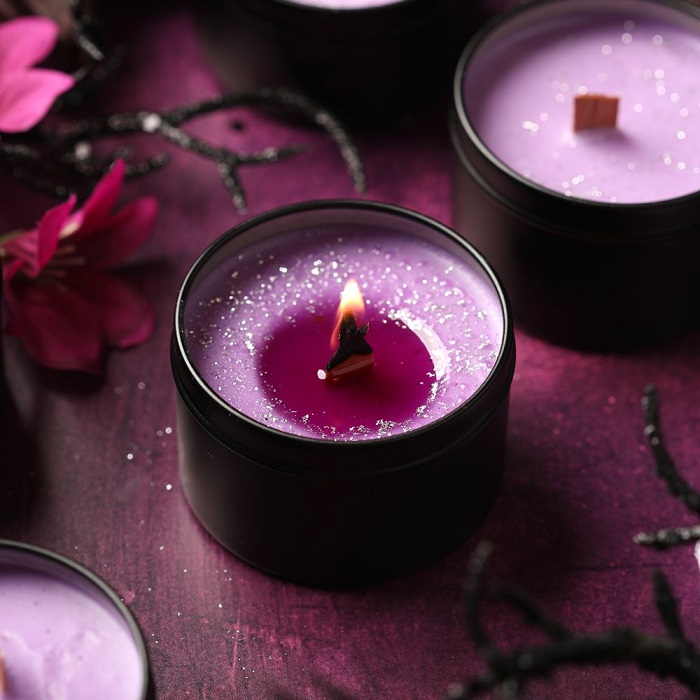 Purple
                candles in tins