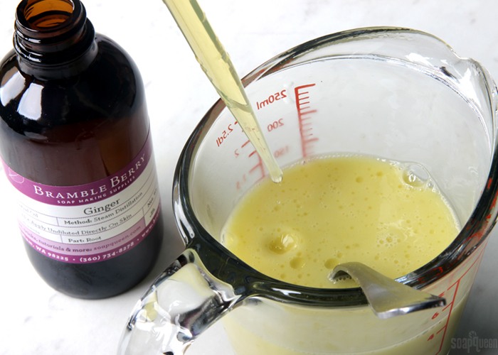 adding drops of ginger essential oil to
                soap | bramble berry